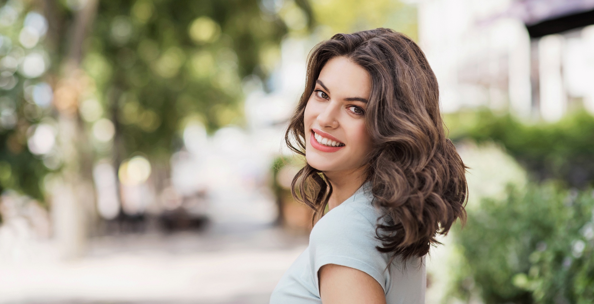 Photo of a happy young woman with wrinkle-free skin after BOTOX® Cosmetic treatments