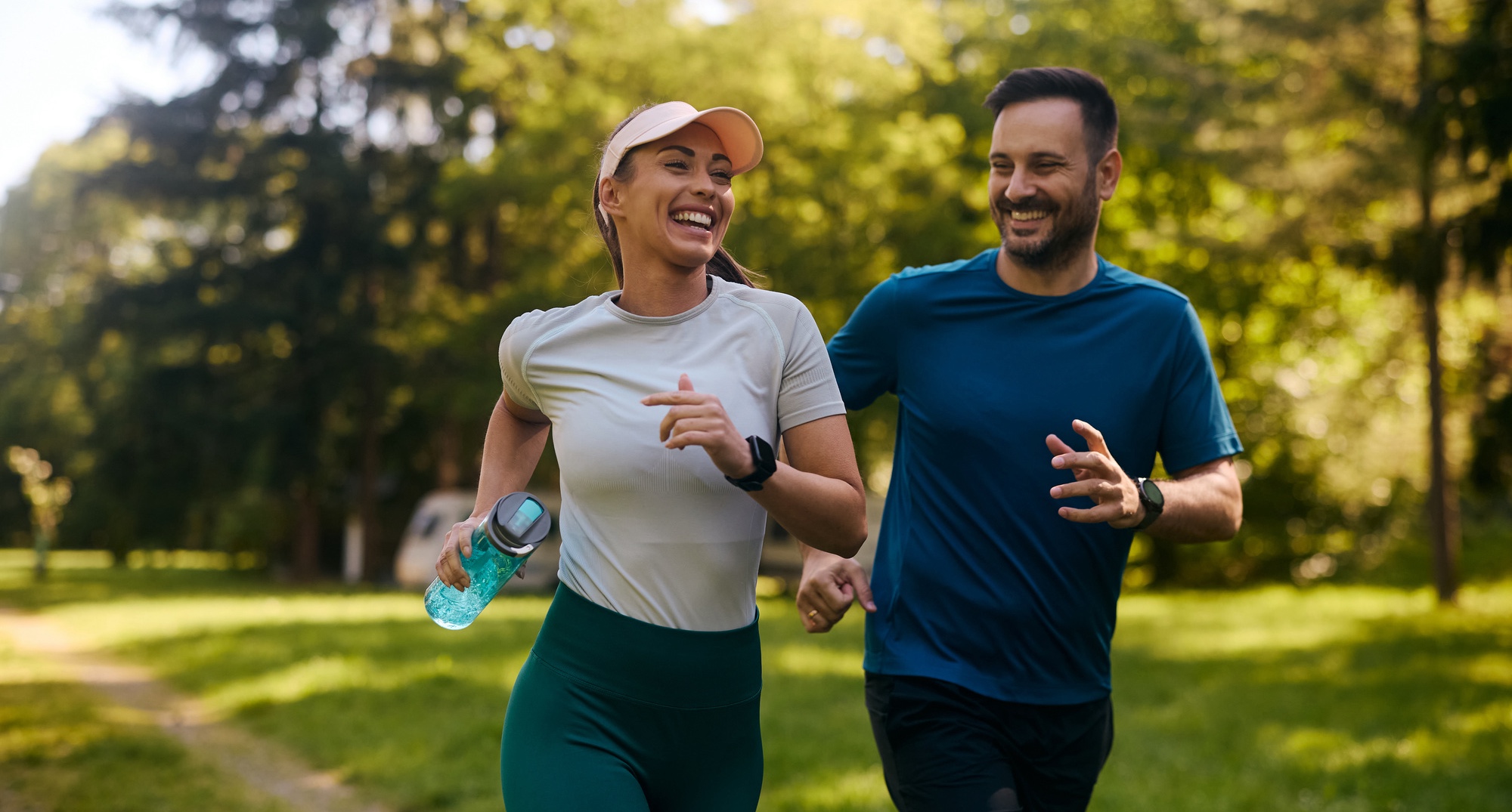 Happy athletic couple having fun while running together after a medical weight loss consultation