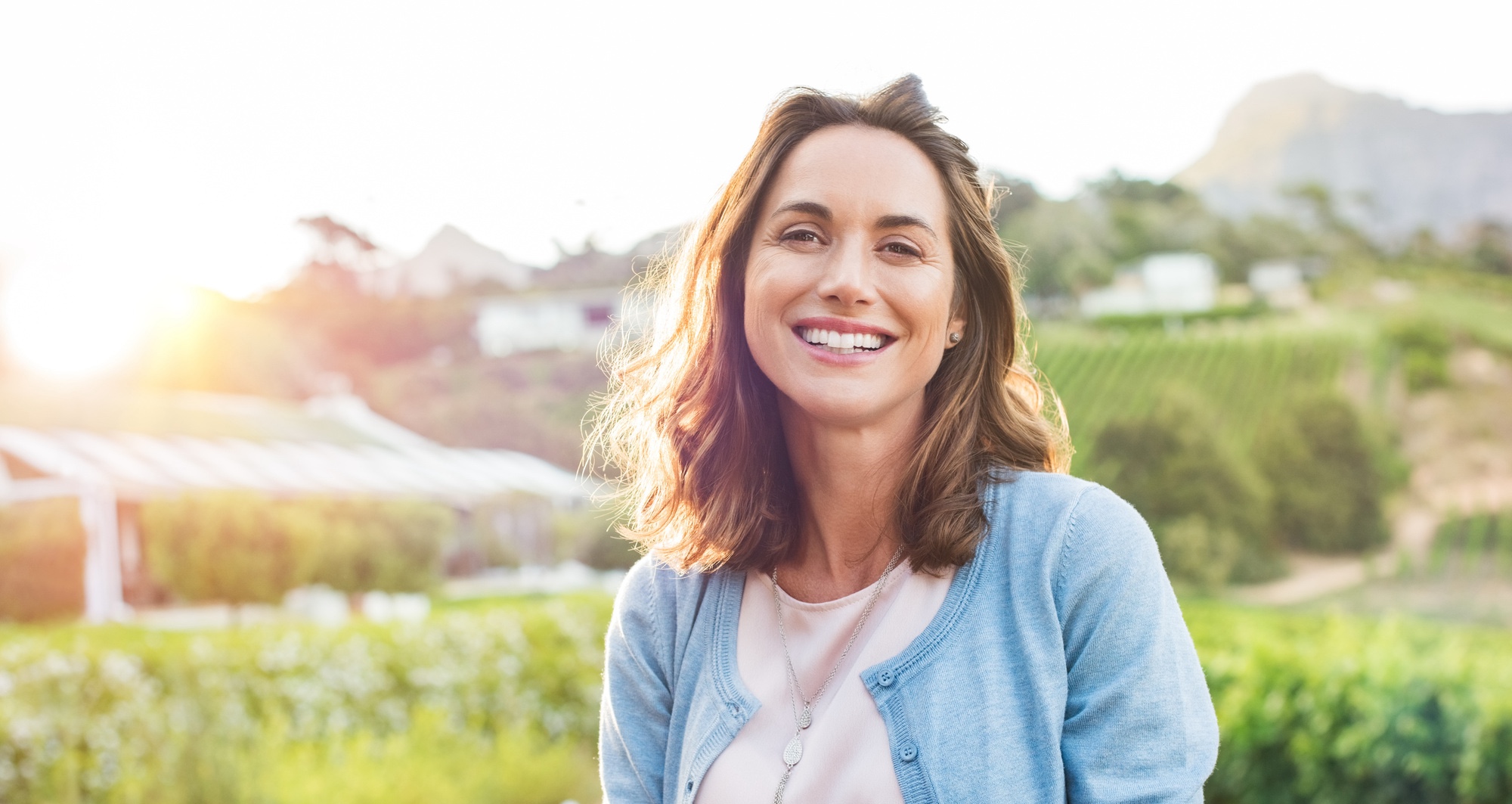 Photo of a smiling woman with youthful skin after Sculptra® treatments