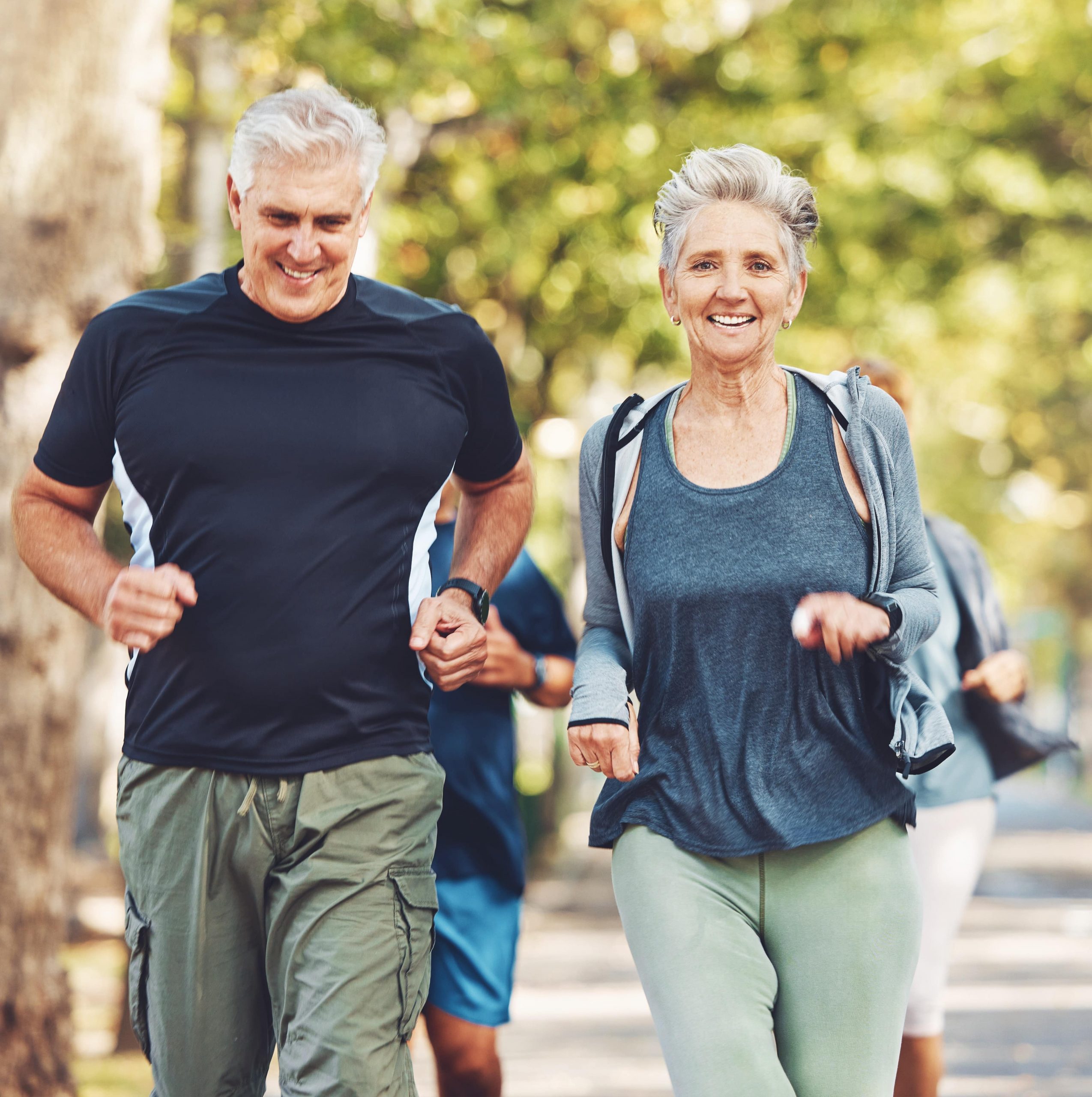 Happy elderly couple, friends or running team by trees for exercise, health or outdoor workout