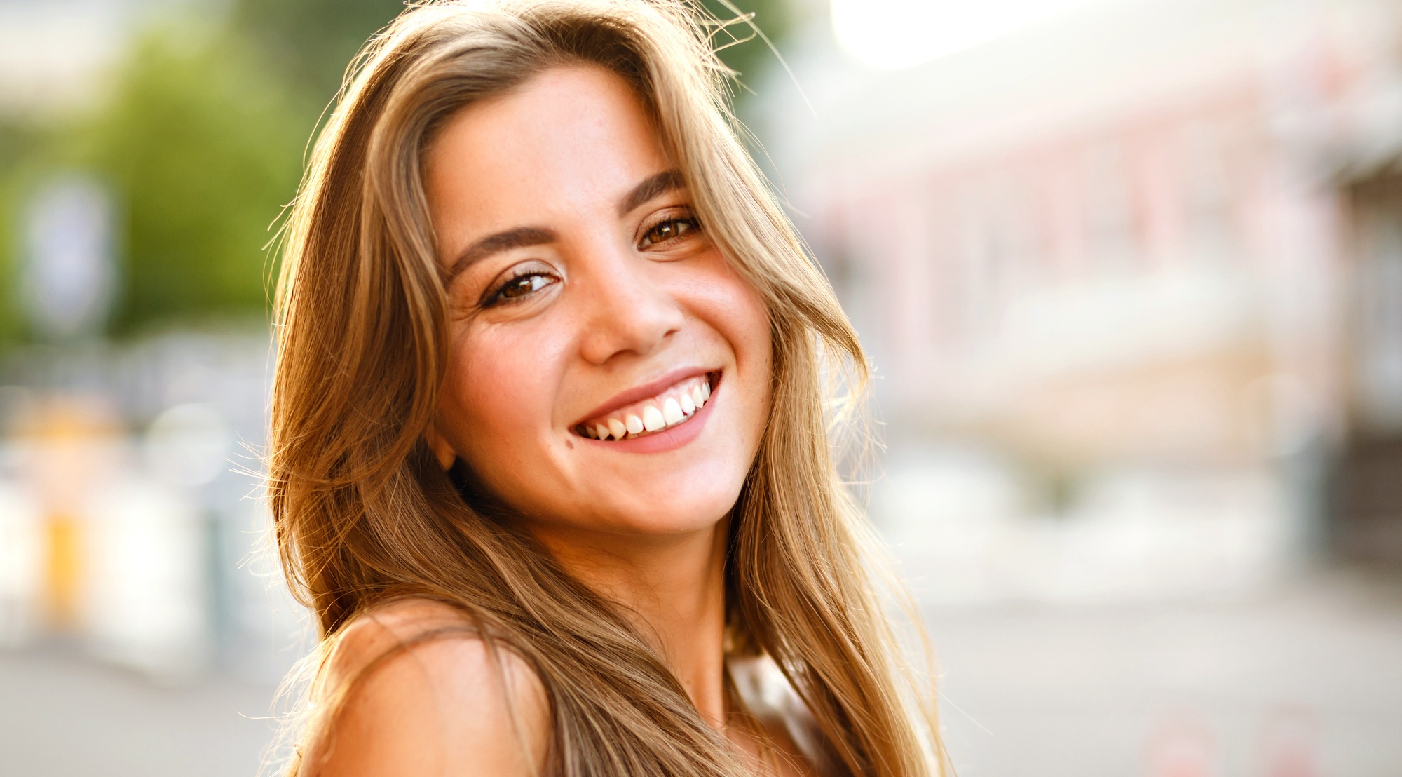 Elegant young magnificent woman with big brown eyes and amazing smile